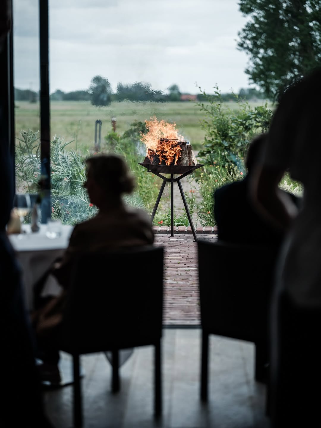 Where fire burns, stories begin 🔥

Fire is a primal element that plays a role not only in Willem Hiele’s cuisine, but also in the atmosphere and experience of the restaurant.

While our guests enjoy an evening at the table indoors, the fire continues to burn outside.

A quiet presence that feels entirely at home in the world of Willem Hiele.

#willemhiele
#michelinrestaurant
#worlds50best