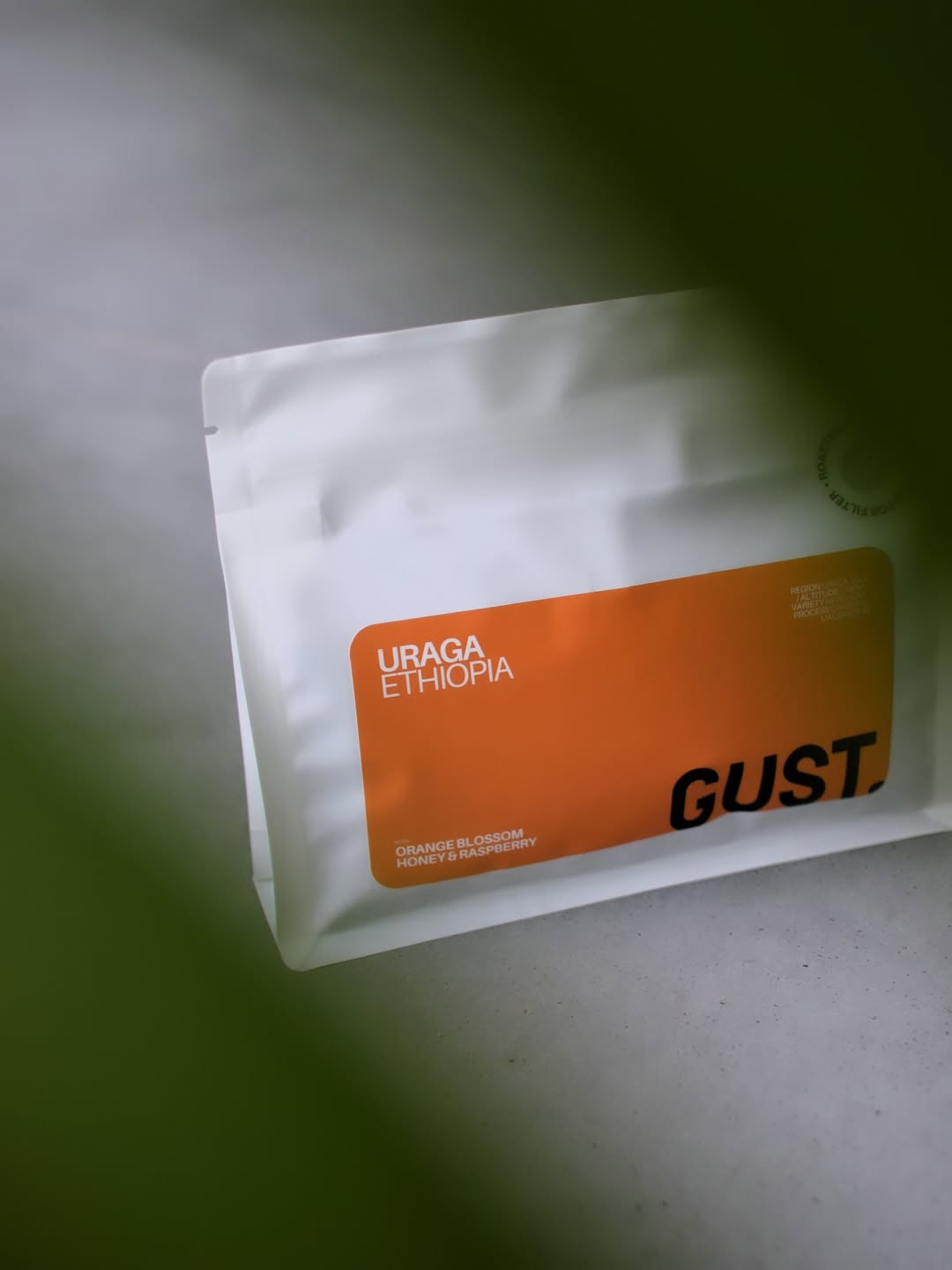 Juicy and expressive. A truly distinctive Ethiopian coffee from Uraga, Guji.

This Grade 1 lot is processed using carbonic maceration — a technique inspired by winemaking that creates a CO₂-rich fermentation environment while keeping the coffee cherries intact.
Like anaerobic fermentation, carbonic maceration takes place in a sealed environment. The key difference is that anaerobic fermentation refers primarily to the absence of oxygen, while carbonic maceration creates an environment rich in carbon dioxide.
This change in the fermentation environment influences which microorganisms thrive and how they interact with the coffee cherry.
The result can be remarkably distinctive flavours and aromas, often bringing increased fruitiness, sweetness and wine-like character to the cup.

For this lot, farmers selectively handpick ripe cherries before delivering them to the Uraga Washing Station, where the cherries are carefully hand-sorted to remove under-ripe, over-ripe or damaged fruit.
The cherries are then placed into sealed containers, with the skins left intact, and left to ferment for several days or weeks. Once fermentation is complete, the cherries are washed and laid out on raised beds to dry. They are regularly raked to ensure an even drying process.

The result? A cup bursting with raspberry, plum and strawberry, layered with lemon and orange blossom, tropical sweetness and a distinct winey character that lingers through the finish.

A coffee for those who enjoy Ethiopia at its most fruity, floral and expressive.


#SpecialtyCoffee #EthiopiaCoffee #GujiCoffee #UragaCoffee #carbonicmaceration
