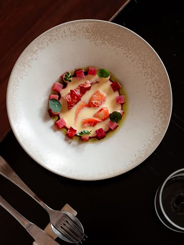 We love soups in Poland! They’re deeply rooted in our culinary heritage. One of the most iconic is chłodnik litewski, a cold beetroot soup traditionally made with buttermilk, fresh herbs such as dill and chives, and boiled egg.

For us, it’s always about finding a natural meeting point between the flavours Chef Jakub grew up with and the ingredients of our region. So we paired it with Oosterschelde lobster - the most local lobster we could get.

The dish is finished with salt-baked Chioggia beetroot, diced and added for texture and a little surprise - the colour is always a mystery after baking. Dill oil and a shiso dressing bring freshness, acidity and a subtle herbal note.

Plate @studiomattes
Photo @marjorie_romeijn