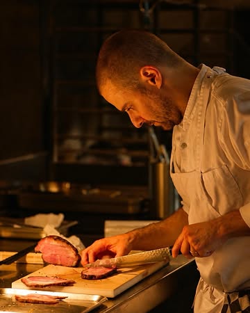 Chef Yves slicing Iberian pork.